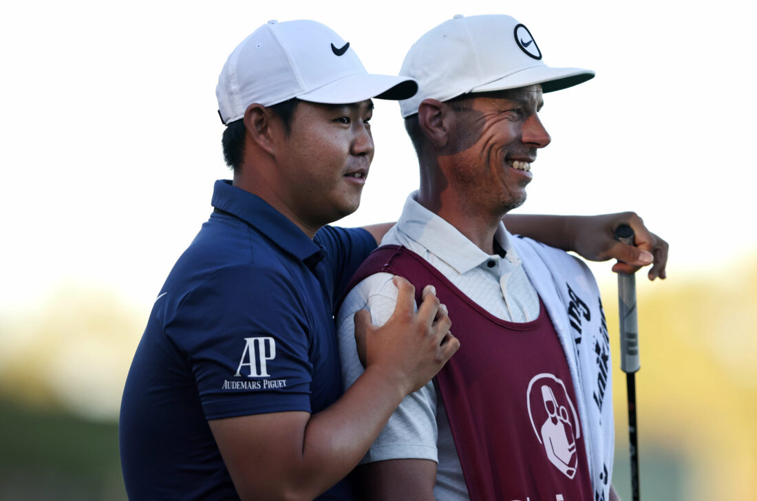 LAS VEGAS, NEVADA - OCTOBER 15: Tom Kim of South Korea reacts to his winning putt on the 18th green with his caddie Joseph Skovron during the final round of the Shriners Children's Open at TPC Summerlin on October 15, 2023 in Las Vegas, Nevada. (Photo by Michael Owens/Getty Images) tour news