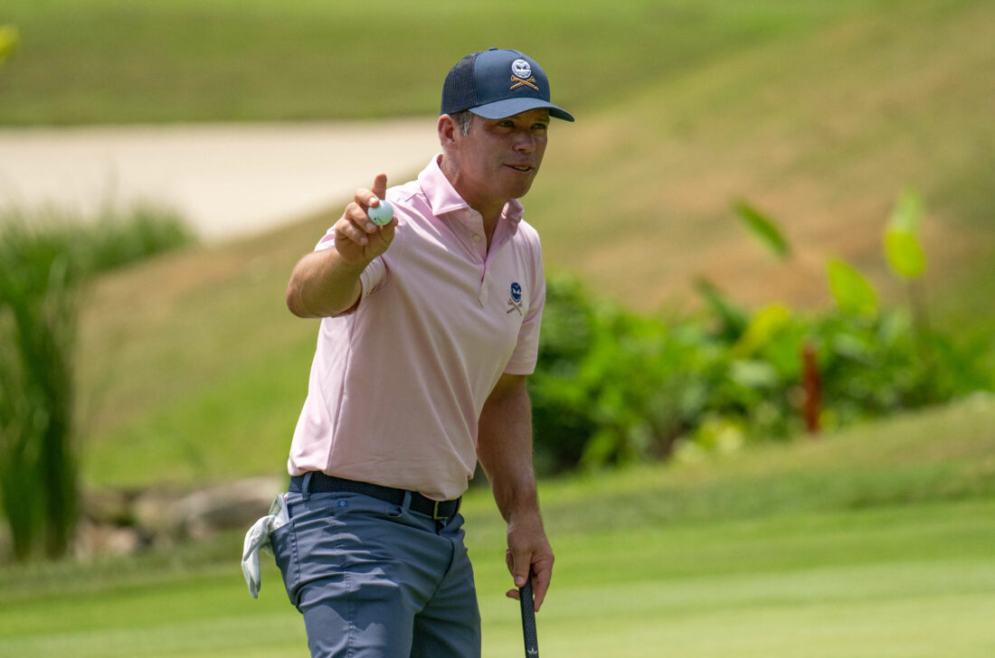 SINGAPORE, SINGAPORE - MARCH 22: Paul Casey of England acknowledges the crowd after holing his putt on hole 6 during Day Two of the Porsche Singapore Classic at Laguna National Golf Resort Club on March 22, 2024 in Singapore. (Photo by Jason Butler/Getty Images)