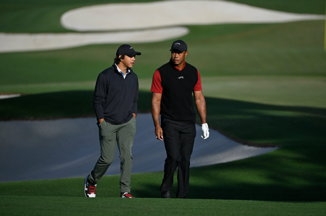 AUGUSTA, GEORGIA - APRIL 14: Tiger Woods with his son Charlie as he makes his way around the practice range for the final round of Masters Tournament at Augusta National Golf Club on April 14, 2024 in Augusta, Georgia. (Photo by Ben Jared/PGA TOUR via Getty Images)