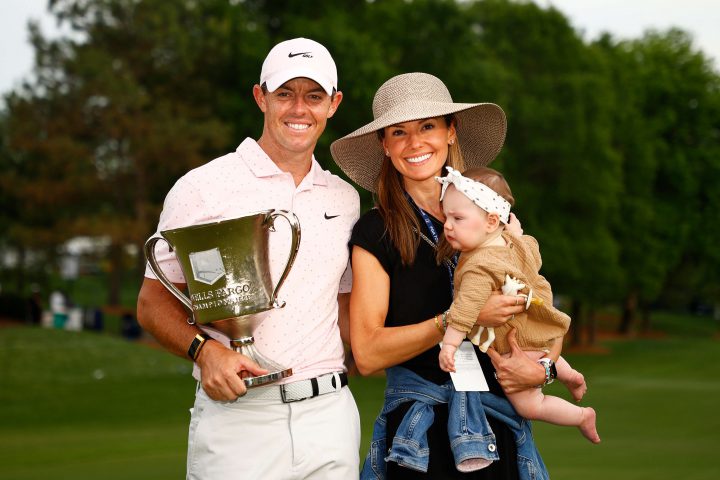 Rory McIlroy of Northern Ireland celebrates with the trophy alongside his wife Erica and daughter Poppy after winning during the final round of the 2021 Wells Fargo Championship at Quail Hollow Club on May 09, 2021 in Charlotte, North Carolina. (Photo by Jared C. Tilton/Getty Images)