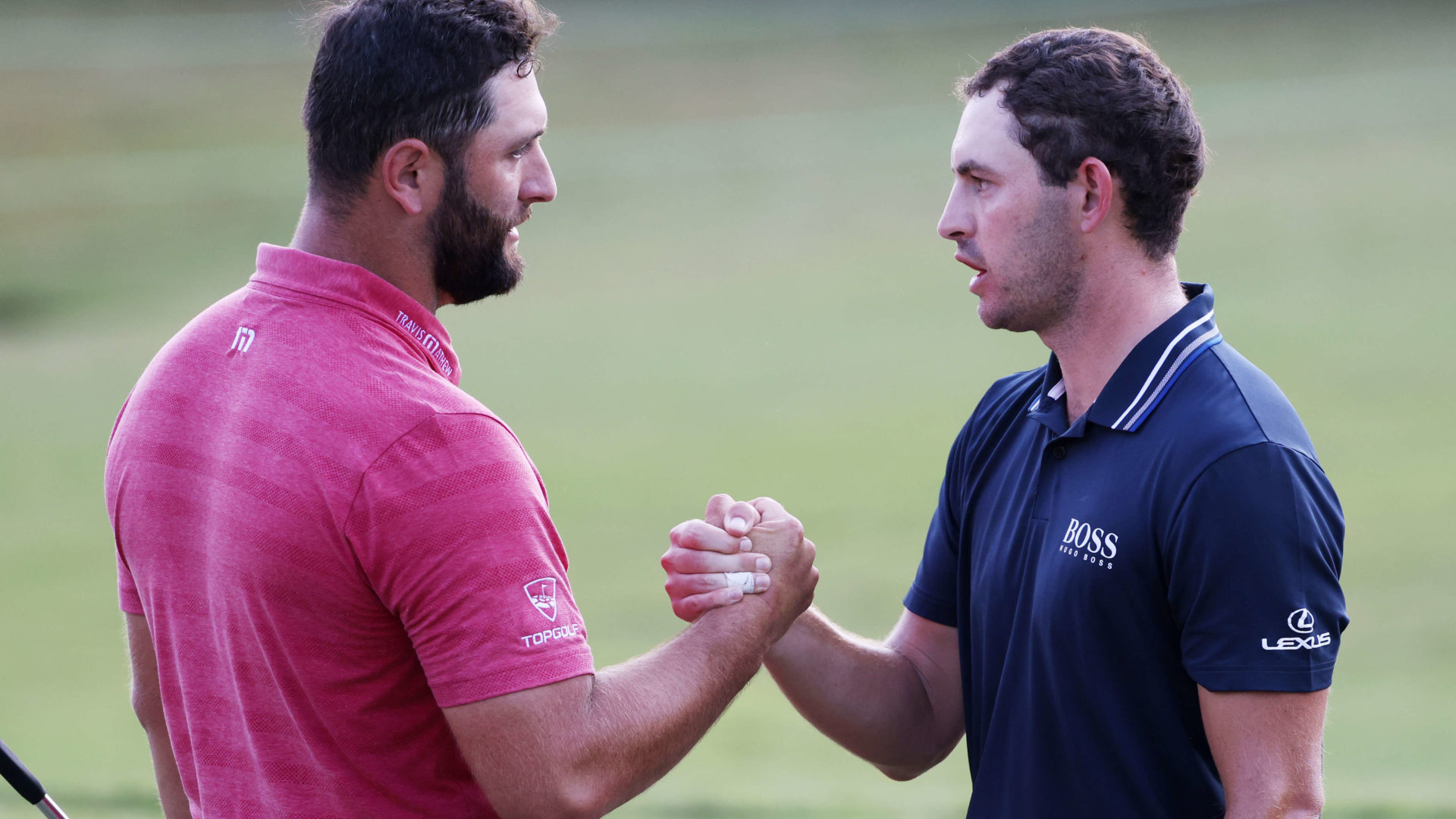 ATLANTA, GEORGIA - SEPTEMBER 05: Jon Rahm of Spain congratulates Patrick Cantlay of the United States on the 18th green after Cantlay won during the final round of the TOUR Championship at East Lake Golf Club on September 05, tour news, 2021 in Atlanta, Georgia. (Photo by Kevin C. Cox/Getty Images)