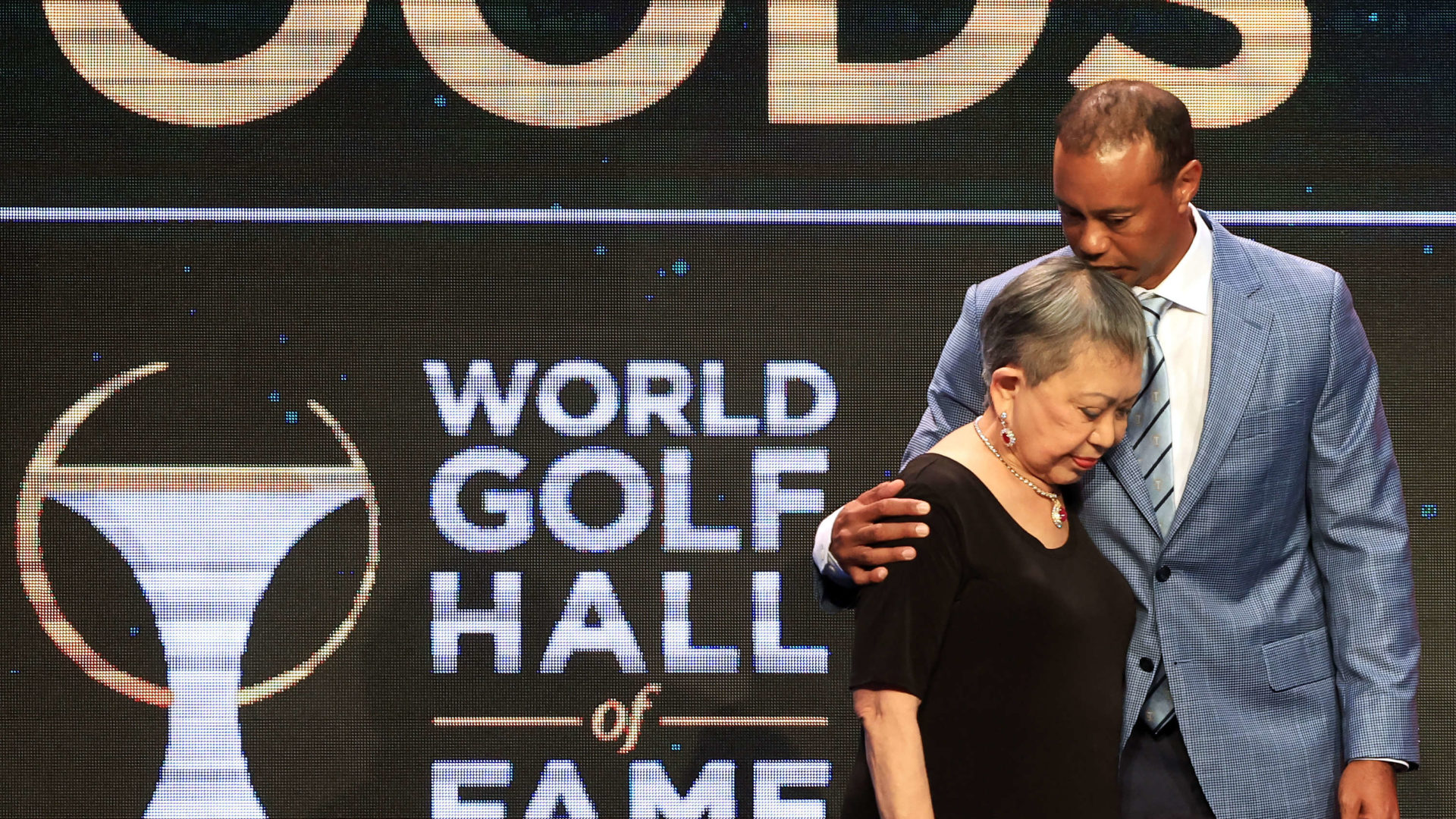 PONTE VEDRA BEACH, FLORIDA - MARCH 09: Tiger Woods and his mother Kultida Woods react as they pose for photos prior to his induction at the 2022 World Golf Hall of Fame Induction at the PGA TOUR Global Home on March 09, 2022 in Ponte Vedra Beach, Florida. (Photo by Sam Greenwood/Getty Images)