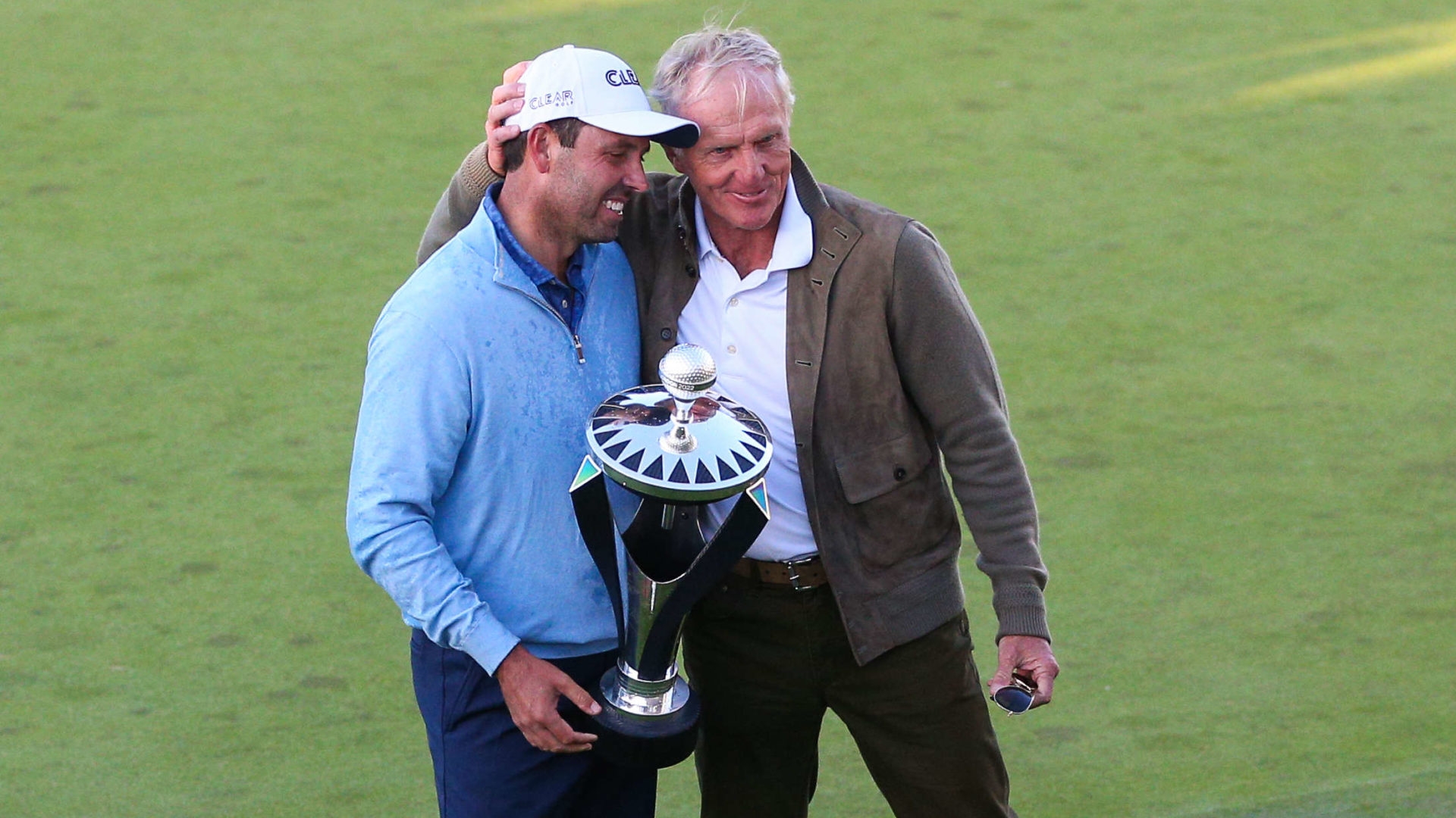 ST ALBANS, ENGLAND - JUNE 11: Charl Schwartzel of South Africa holds the winners trophy and poses for a photo with Greg Norman, LIV Golf CEO, after day three of the LIV Golf Invitational at The Centurion Club on June 11, 2022 in St Albans, England. liv golf (Photo by Craig Mercer/MB Media/Getty Images)