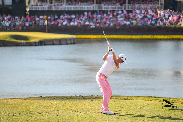 PONTE VEDRA BEACH, FL - MAY 10: Justin Thomas tees off on the 17th hole island green during the final round of THE PLAYERS Championship on THE PLAYERS Stadium Course at TPC Sawgrass on May 10, 2015 in Ponte Vedra Beach, Florida. (Photo by Chris Condon/PGA TOUR)