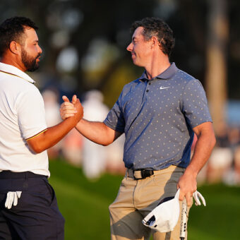 PONTE VEDRA BEACH, FL - MARCH 15: PGA golfers J.J. Spaun and Rory McIlroy shake hands after finishing on the 18th green during the third round of The Players Championship at the Stadium Course at TPC Sawgrass on March 15, 2025, at Ponte Verde Beach, Florida. (Photo by Brian Spurlock/Icon Sportswire via Getty Images)