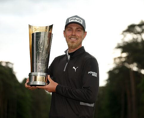 ANTWERP, BELGIUM - MAY 25: Kristoffer Reitan of Norway poses with the Soudal Open trophy following victory in the second playoff hole on day four of the Soudal Open 2025 at Rinkven International GC on May 25, 2025 in Antwerp, Belgium. (Photo by Luke Walker/Getty Images)
