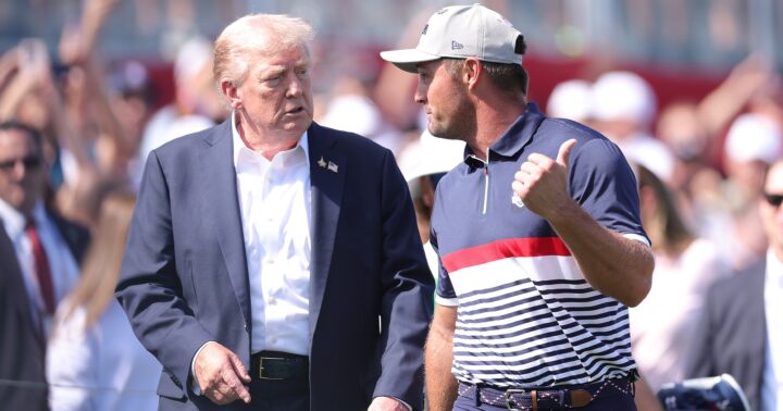 FARMINGDALE, NEW YORK - SEPTEMBER 26: U.S. President Donald Trump speaks with Bryson DeChambeau of Team United States on the first tee during the Friday afternoon four-ball matches of the 2025 Ryder Cup at Black Course at Bethpage State Park Golf Course on September 26, 2025 in Farmingdale, New York. (Photo by Andrew Redington/Getty Images)