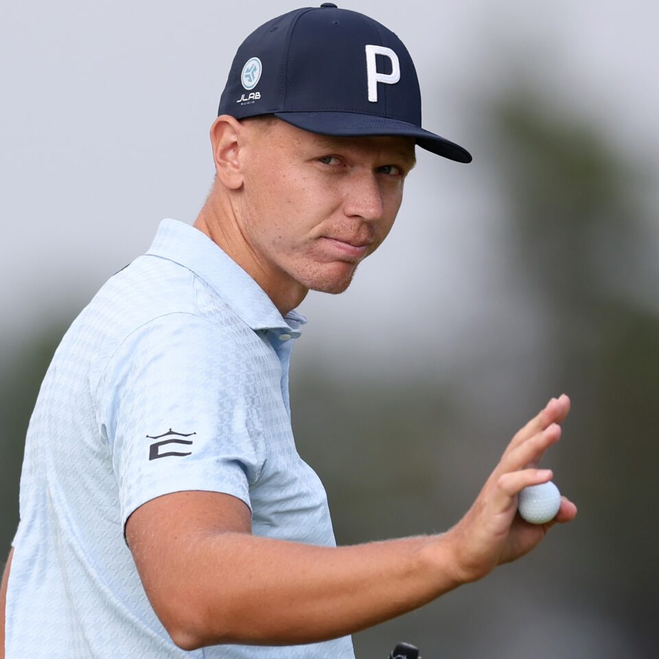 NORTH BERWICK, SCOTLAND - JULY 13: Matti Schmid of Germany acknowledges the crowd as he finishes on the 18th green on day four of the Genesis Scottish Open 2025 at The Renaissance Club on July 13, 2025 in North Berwick, Scotland. (Photo by Andrew Redington/Getty Images)