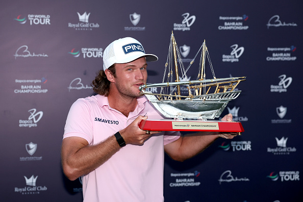 BAHRAIN, BAHRAIN - FEBRUARY 01: Freddy Schott of Germany trophy poses with the trophy following victory on day four of the Bahrain Championship 2026 at Royal Golf Club on February 01, 2026 in Bahrain, Bahrain. (Photo by Warren Little/Getty Images)