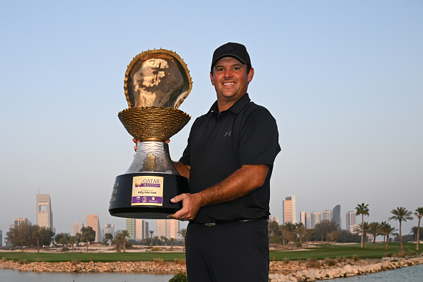 DOHA, QATAR - FEBRUARY 08: Patrick Reed of the United States poses with the trophy following victory on day four of the Qatar Masters 2026 at Doha Golf Club on February 08, 2026 in Doha, Qatar. (Photo by Stuart Franklin/Getty Images)