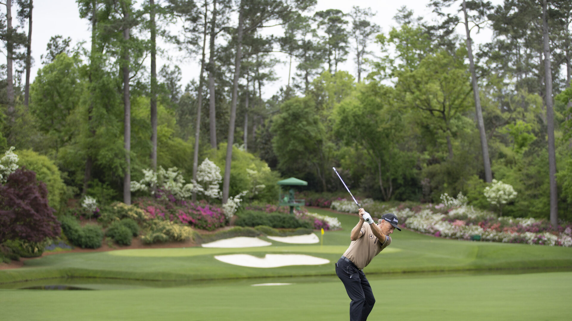 Masters champion Bernhard Langer of Germany plays a stroke from the No. 12 tee during a practice round prior to the Masters at Augusta National Golf Club, Sunday, April 05, 2026.