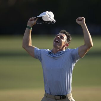 Masters champion Rory McIlroy of Northern Ireland celebrates on No. 18 with clenched fists after his back-to-back victory during the final round of the Masters at Augusta National Golf Club, Sunday, April 12, 2026.