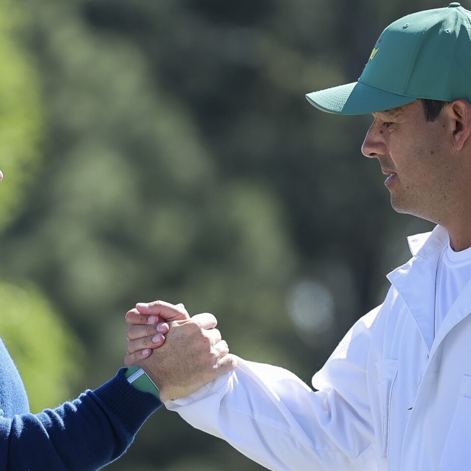 AUGUSTA, GEORGIA - APRIL 09: Rory McIlroy of Northern Ireland and his caddie Harry Diamond shake hands on the 18th green during the first round of the 2026 Masters Tournament at Augusta National Golf Club on April 09, 2026 in Augusta, Georgia. (Photo by Hector Vivas/Getty Images)